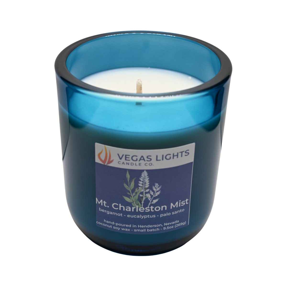 Blue candle jar with a Vegas Lights Candle Co. label on a white background