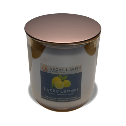 Vegas Lights Candle Co. Lucky Lemon candle with a bronze lid on a white background
