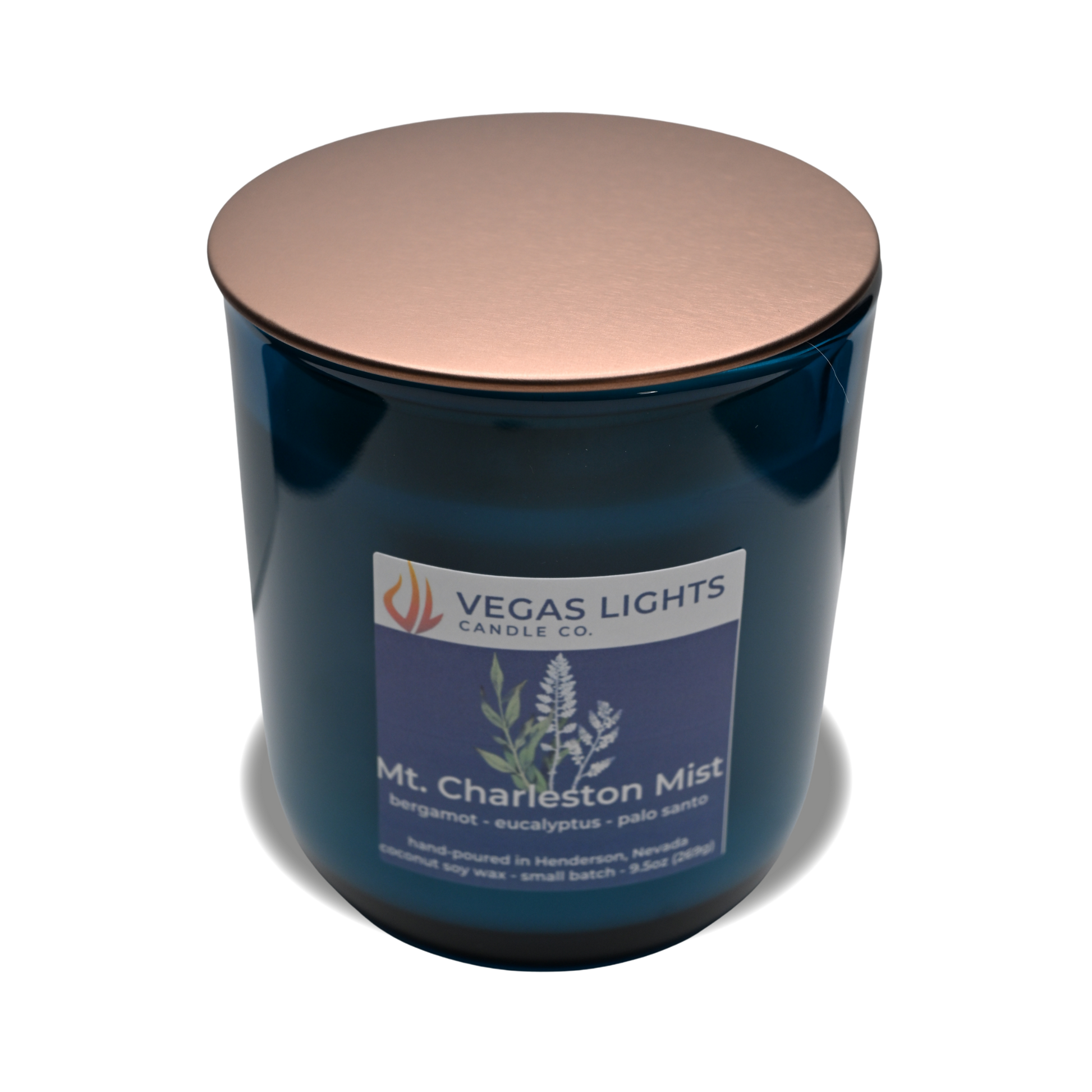 Blue candle with a copper lid and 'Vegas Lights Candle Co.' label on a white background