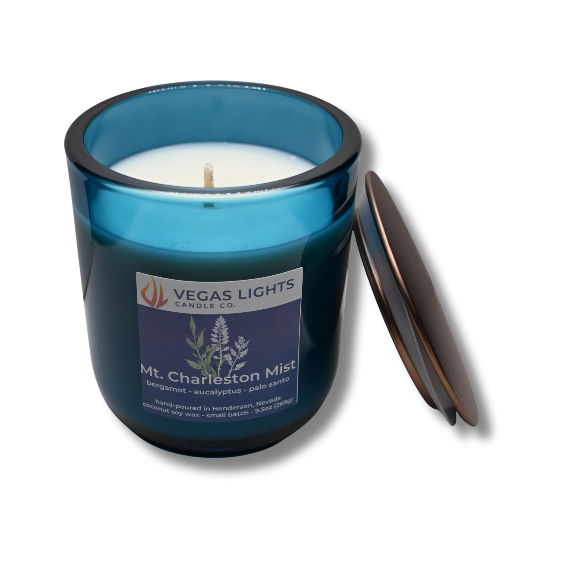 Blue candle jar with a white candle inside, featuring the Vegas Lights Candle Co. logo on a white background.