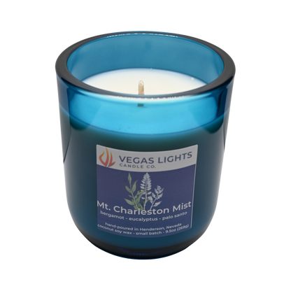 Blue candle jar with a Vegas Lights Candle Co. label on a white background