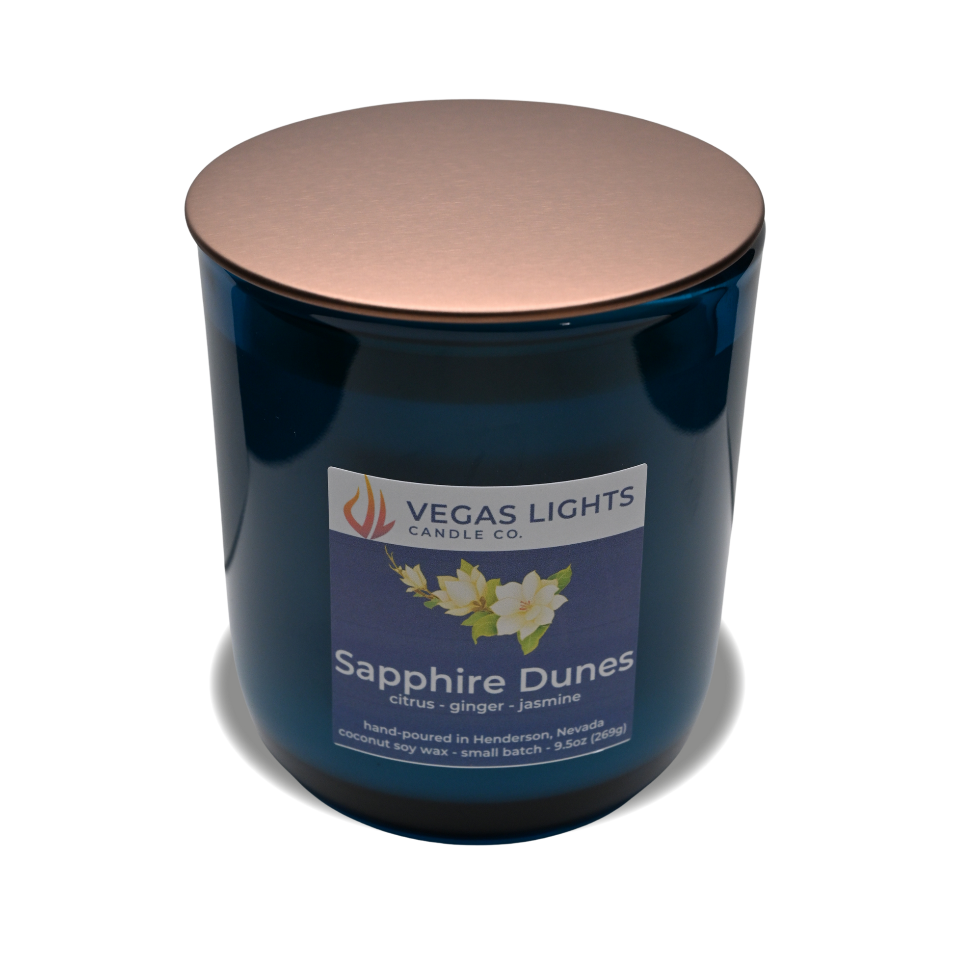 Blue jar candle with a bronze lid labeled 'Vegas Lights Candle Co. Sapphire Dunes' on a white background