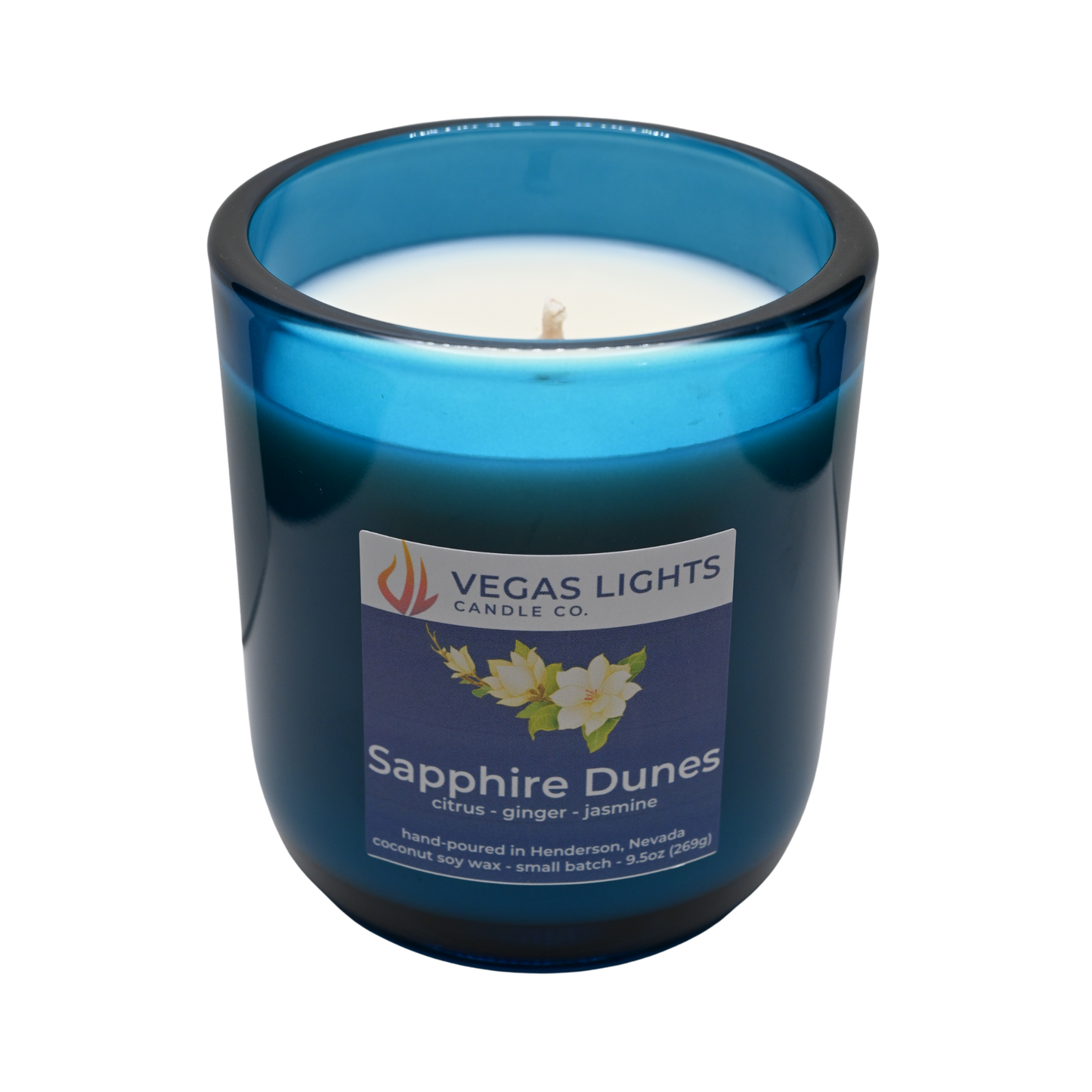 Vegas Lights Candle Co. Sapphire Dunes candle in a blue glass container on a white background