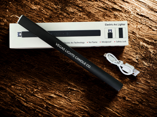 Black electric lighter with packaging on a wooden surface