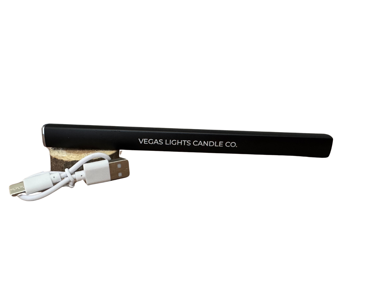 Black lighter with USB cable and wooden base on a white background, branded 'Vegas Lights Candle Co'.