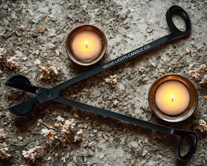 A wick trimmer labeled with the Vegas Light Candle Company name