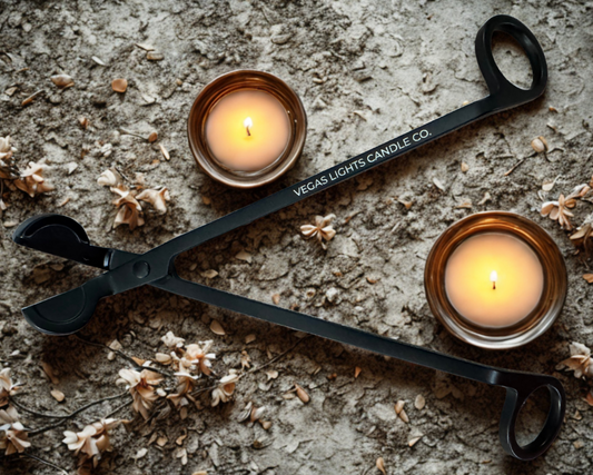 A wick trimmer labeled with the Vegas Light Candle Company name